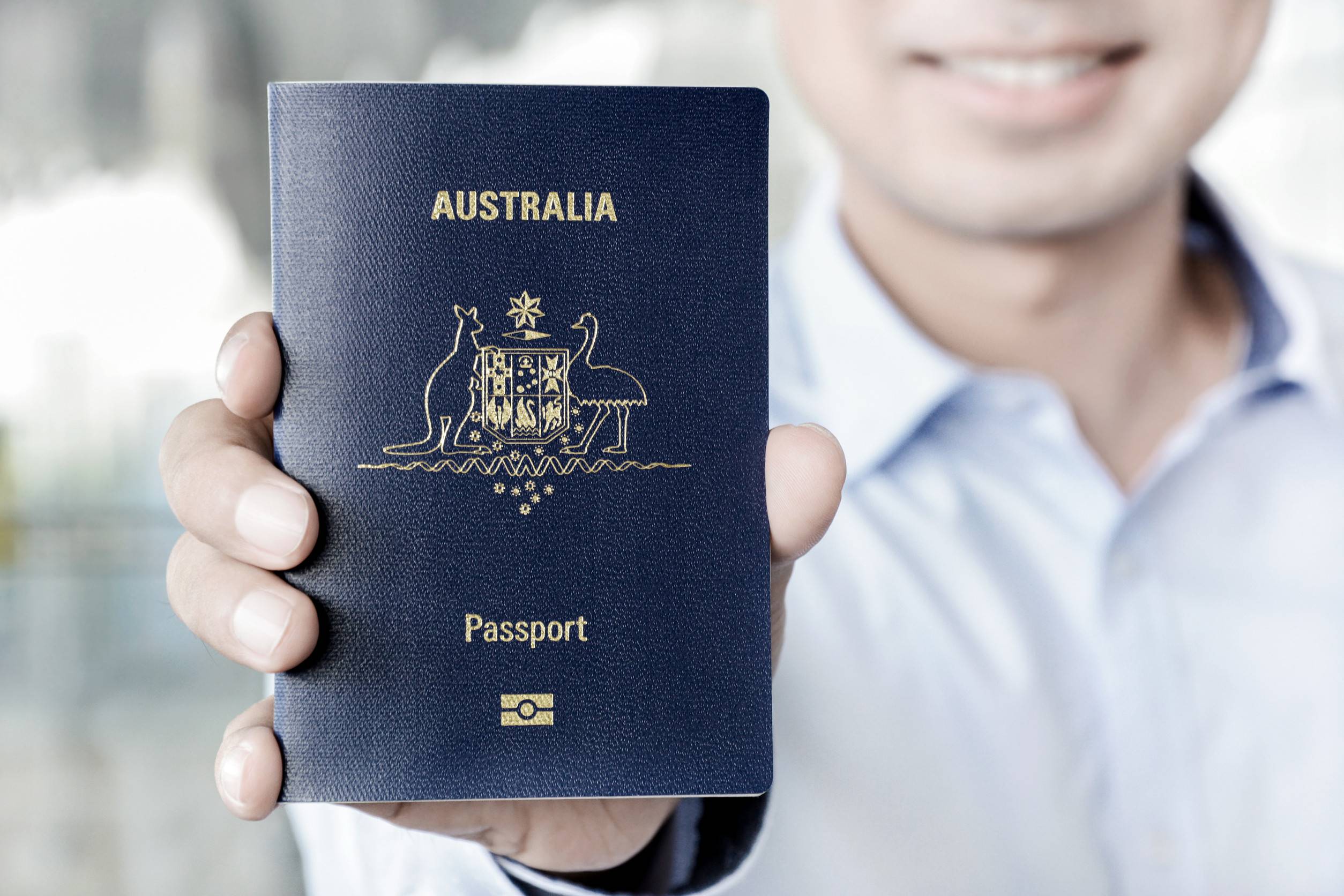 A man showing passport of Australia